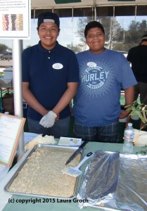 Rafael Castillejo and Javier Reyes of Reality Changers volunteered at the lima bean festival, serving Mary Dralle's Lemony Lima Poppyseed Cake. (Photo by Laura Groch)